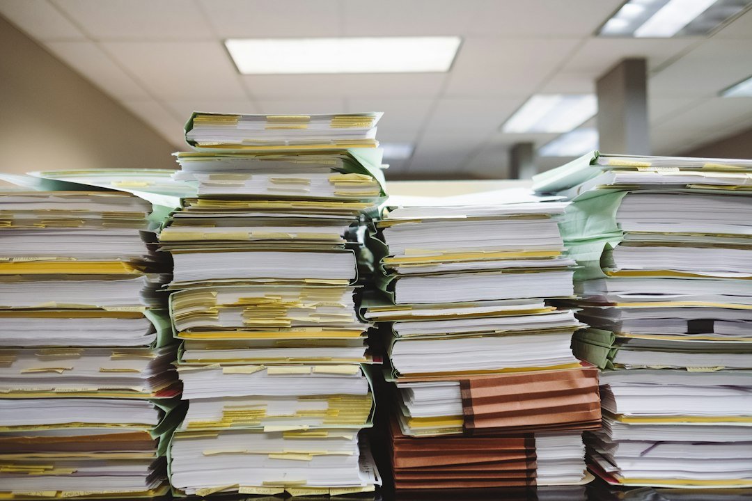 Stacks of paperwork and file folders in an office