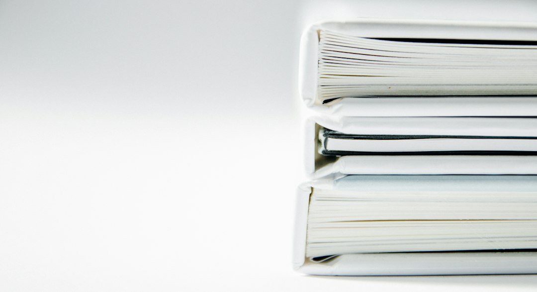 Stack of white document binders